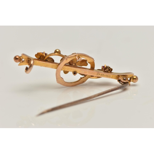 86 - AN EARLY 20TH CENTURY 15CT GOLD BAR BROOCH, floral bar brooch set with a single old cut diamond and ... 