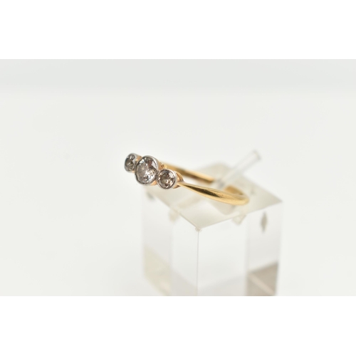 129 - A YELLOW METAL THREE STONE DIAMOND RING, set with a three old cut diamonds, estimated total diamond ... 