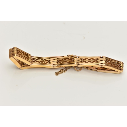 144 - A YELLOW METAL ARTICULATED BRACELET, designed as a series of open work rectangular links, fitted wit... 