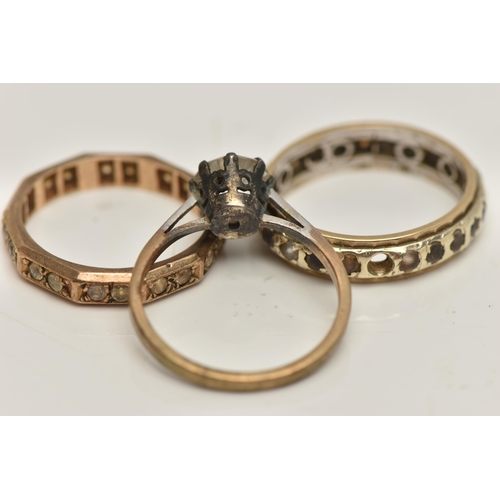 150 - THREE RINGS, to include a yellow metal full eternity ring, set with colourless spinel, unmarked, rin... 