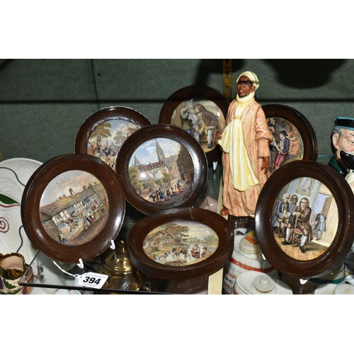 394 - A ROYAL DOULTON 'IBRAHIM' FIGURE AND SEVEN FRAMED PRATTWARE POT LIDS, comprising Royal Doulton Ibrah... 