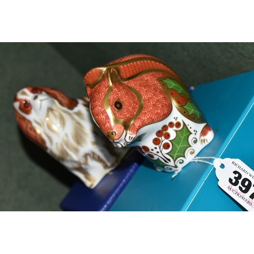 397 - TWO BOXED ROYAL CROWN DERBY PAPERWEIGHTS, comprising Christmas Squirrel and Cavalier King Charles Sp... 