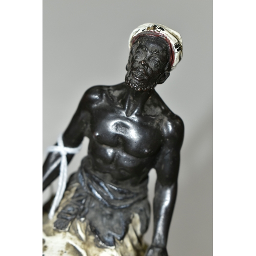 385 - A BERGMANN STYLE COLD PAINTED BRONZE OF AN ARMS DEALER, the figure kneeling on a rug with various we... 