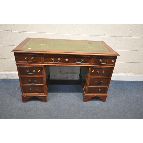 1402 - A REPRODUCTION MAHOGANY TWIN PEDESTAL DESK, with green tooled leather writing surface and an arrange... 