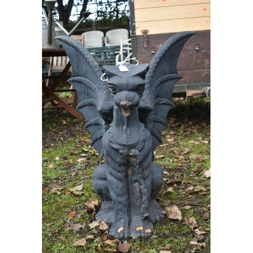 1014 - A HEAVY CAST IRON GARDEN SCULPTURE, of a mythical dragon with outspread wings, width 62cm x depth 41... 