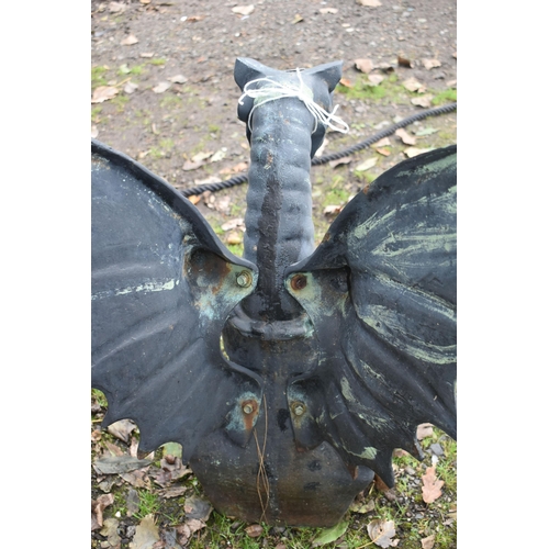 1014 - A HEAVY CAST IRON GARDEN SCULPTURE, of a mythical dragon with outspread wings, width 62cm x depth 41... 