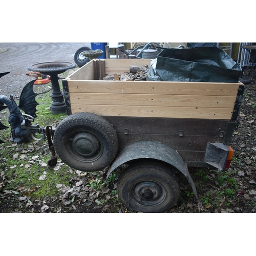 1015 - A SINGLE AXLE TRAILER, with raised sides, box full containing chopped wood,  box width 93cm x 125cm ... 