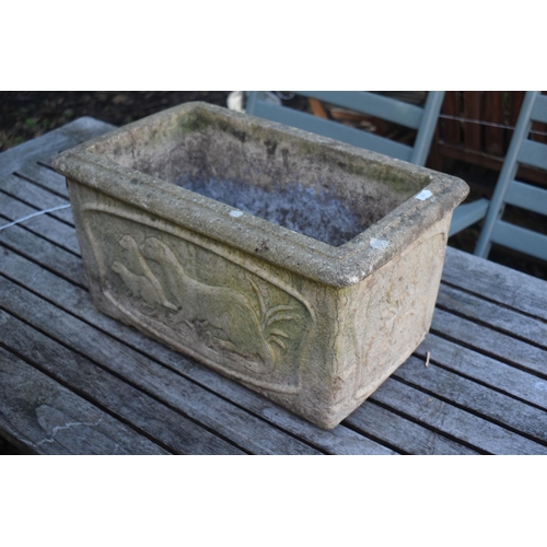 1026 - A COMPOSITE RECTANGULAR PLANTER, with otters embossed to the side, length 49cm