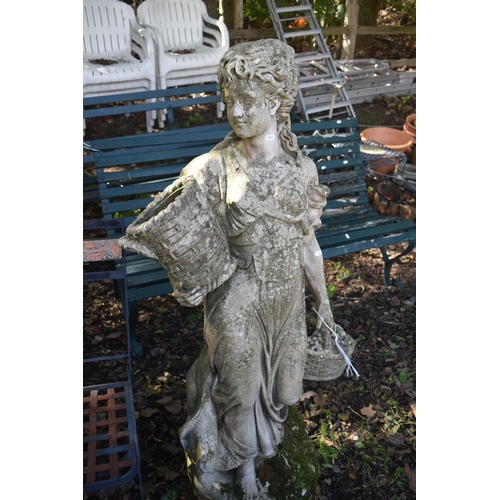 1027 - A WEATHERED COMPOSITE GARDEN STATUE, of a scantily lady carrying baskets, height 136cm (condition re... 