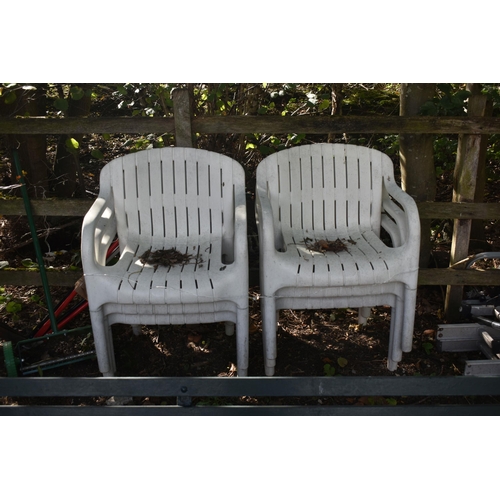 1029 - A SET OF SIX PLASTIC ARMCHAIRS (condition report: weather finish)