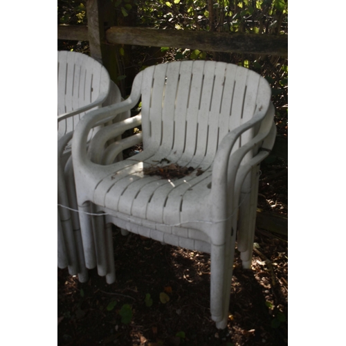 1029 - A SET OF SIX PLASTIC ARMCHAIRS (condition report: weather finish)