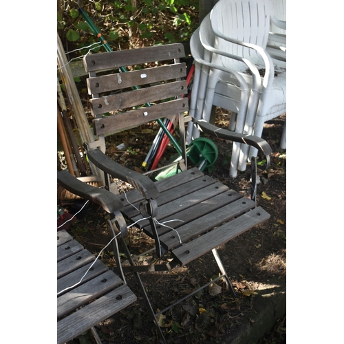 1031 - A PAIR OF IRON AND TEAK FOLDING ARMCHAIRS, along with a painted aluminium garden table (3)