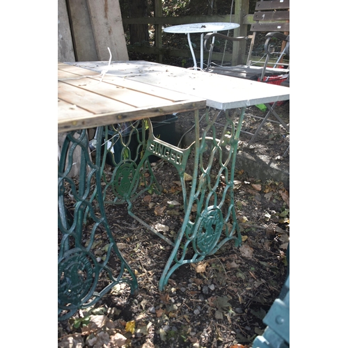 1032 - TWO VINTAGE TREADLE SEWING MACHINE BASES, one with a marble top, the other with a wooden top (2)