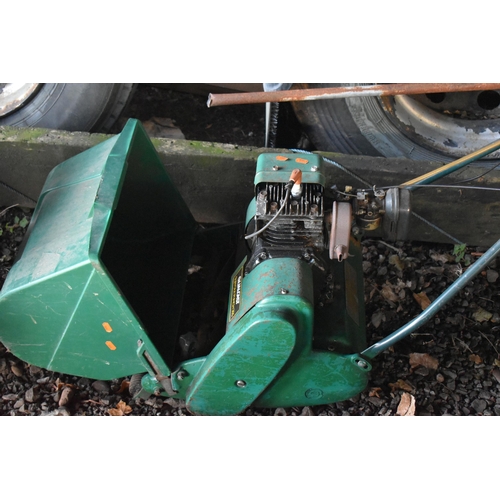 1040 - A QUALCAST CYLINDER LAWNMOWER, with a grass box (condition report: engine turns freely)