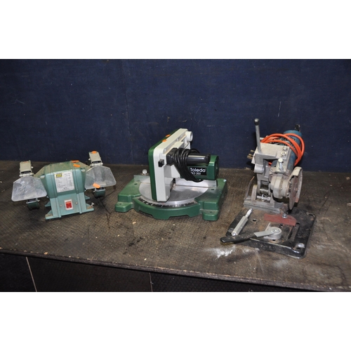 1052 - THREE POWER TOOLS including a Black and Decker angle grinder on stand, a Toledo Mitre saw and a Kinz... 