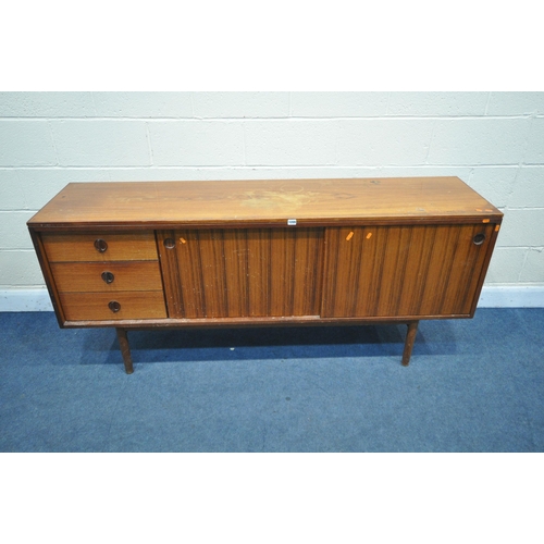 1395 - A GORDON RUSSELL ROSEWOOD SIDEBOARD, with three drawers to the left of cupboards, on circular sectio... 