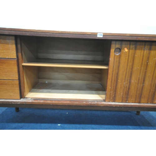 1395 - A GORDON RUSSELL ROSEWOOD SIDEBOARD, with three drawers to the left of cupboards, on circular sectio... 