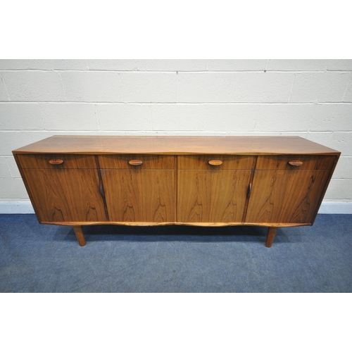 1397 - W H RUSSELL FOR GORDON RUSSELL, A MID-CENTURY MODEL 'BURFORD' R818 ROSEWOOD SIDEBOARD, with a scallo... 