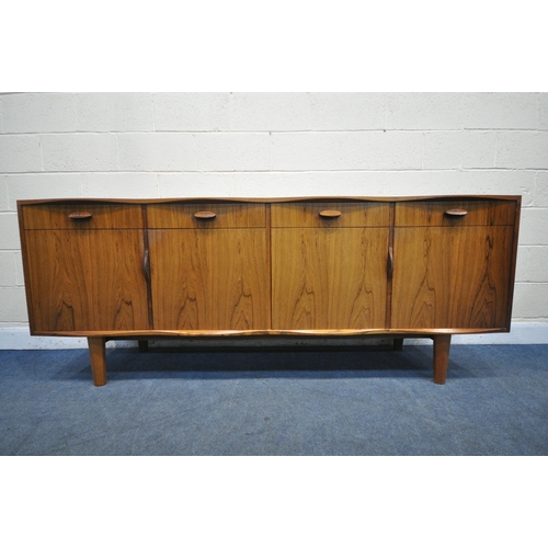 1397 - W H RUSSELL FOR GORDON RUSSELL, A MID-CENTURY MODEL 'BURFORD' R818 ROSEWOOD SIDEBOARD, with a scallo... 