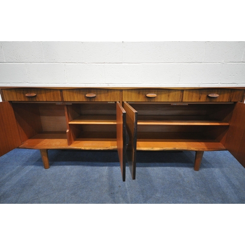 1397 - W H RUSSELL FOR GORDON RUSSELL, A MID-CENTURY MODEL 'BURFORD' R818 ROSEWOOD SIDEBOARD, with a scallo... 