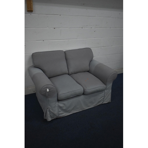 1409 - A PURPLE UPHOLSTERED TWO SEATER SETTEE (condition report: sun bleached in places)