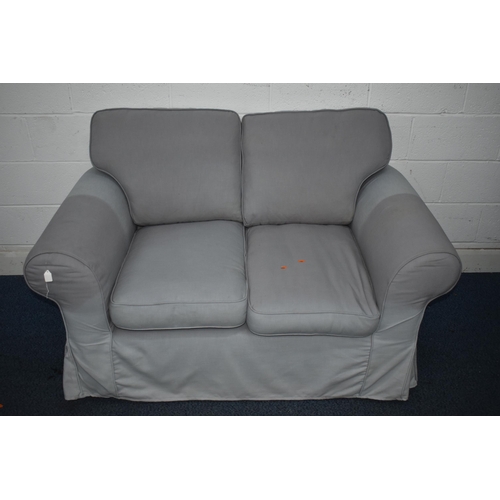 1409 - A PURPLE UPHOLSTERED TWO SEATER SETTEE (condition report: sun bleached in places)