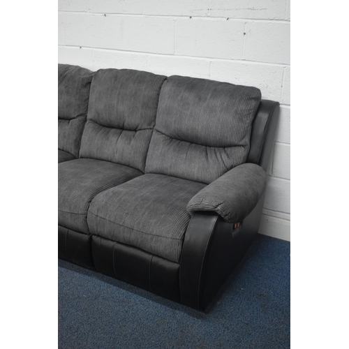 1411 - A BLACK LEATHER AND FABRIC CORNER SUITE, that splits into five sections, one section with a manual r... 