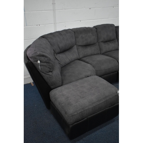 1411 - A BLACK LEATHER AND FABRIC CORNER SUITE, that splits into five sections, one section with a manual r... 