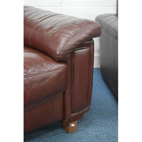 1413 - A BROWN LEATHER FOUR PIECE LOUNGE SUITE, comprising a three seater settee, length 216cm x depth 99cm... 