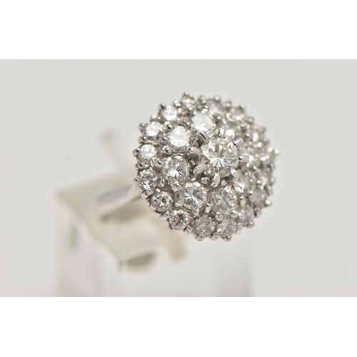 35 - A WHITE METAL DIAMOND CLUSTER DRESS RING, circular cluster of round brilliant cut diamonds, centre s... 