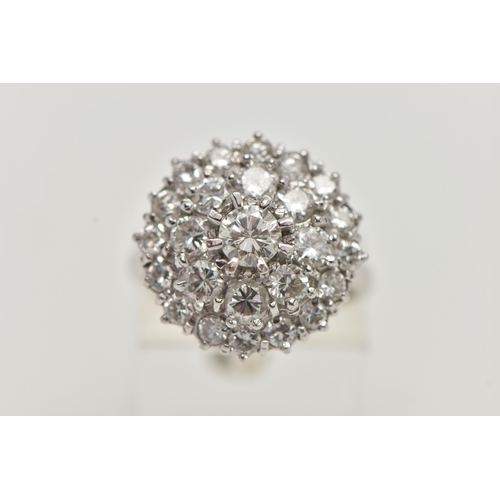 35 - A WHITE METAL DIAMOND CLUSTER DRESS RING, circular cluster of round brilliant cut diamonds, centre s... 