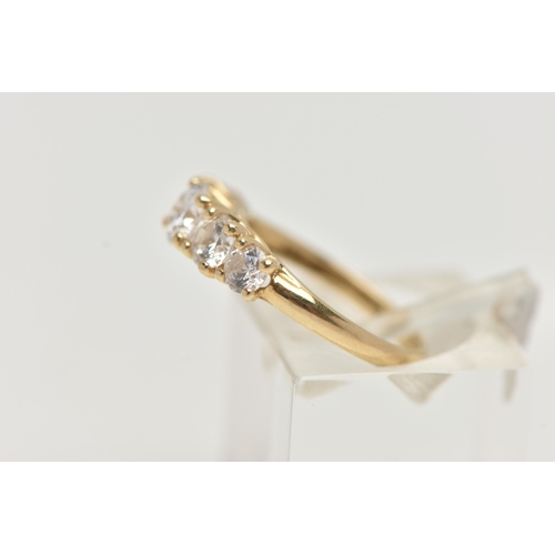 52 - A 14CT GOLD FIVE STONE RING, set with five graduated circular cut, cubic zirconia, claw set to a pol... 