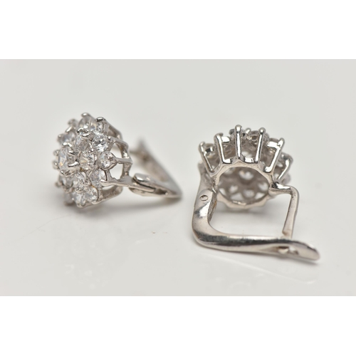 55 - A PAIR OF WHITE METAL CUBIC ZIRCONIA EARRINGS, cluster setting, fitted with posts and lever back fit... 