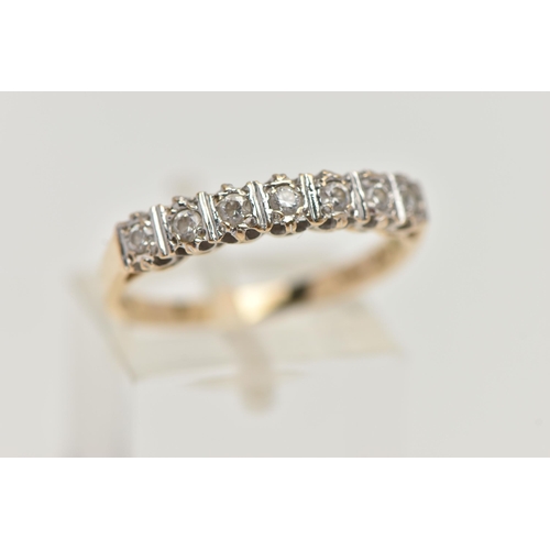 56 - A 15CT GOLD HALF ETERNITY RING, set with a row of circular cut, cubic zirconia, to a polished band, ... 