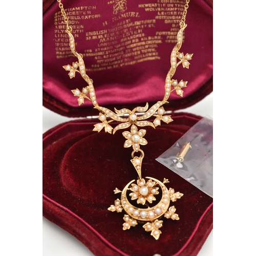 73 - AN EARLY 20TH CENTURY GOLD AND SEED PEARL NECKLACE, a central floral piece leading on to branches an... 