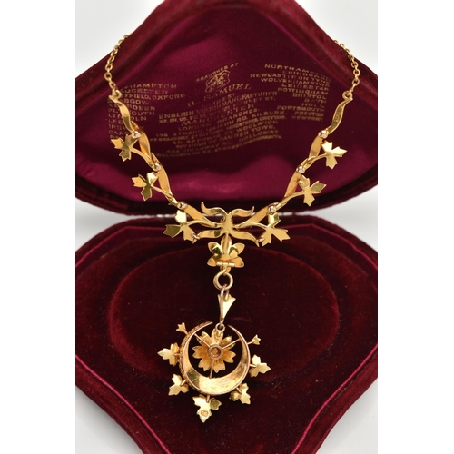 73 - AN EARLY 20TH CENTURY GOLD AND SEED PEARL NECKLACE, a central floral piece leading on to branches an... 