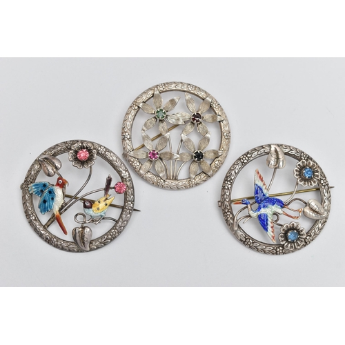 82 - THREE OPEN WORK BROOCHES, the first a circular form brooch with floral detail, an enamel detailed st... 