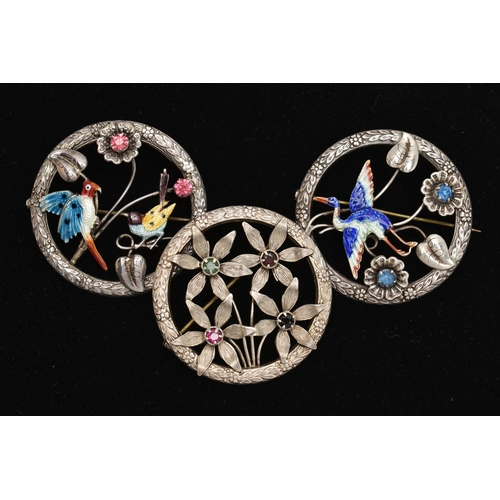 82 - THREE OPEN WORK BROOCHES, the first a circular form brooch with floral detail, an enamel detailed st... 