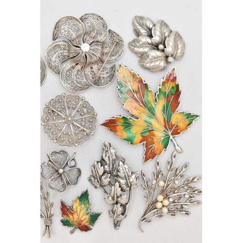 92 - AN ASSORTMENT OF WHITE METAL BROOCHES, eighteen brooches floral and foliage designed brooches, varyi... 