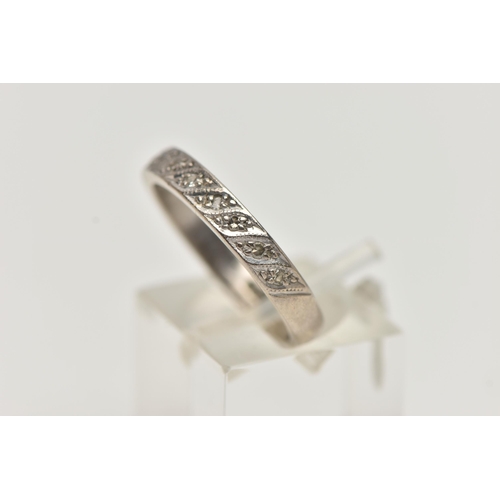 94 - A WHITE METAL DIAMOND HALF ETERNITY RING, set with a row of single cut diamonds, to a polished band,... 