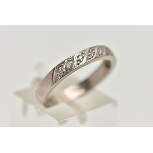 94 - A WHITE METAL DIAMOND HALF ETERNITY RING, set with a row of single cut diamonds, to a polished band,... 