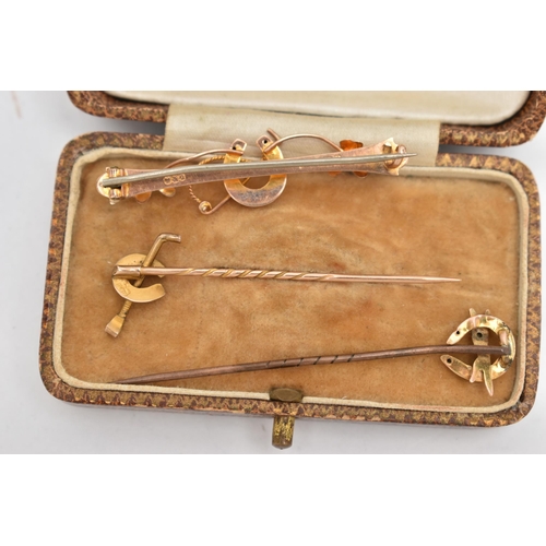 120 - TWO EARLY 20TH CENTURY STICKPINS AND A BROOCH, all of equestrian related design, the brooch with 9ct... 