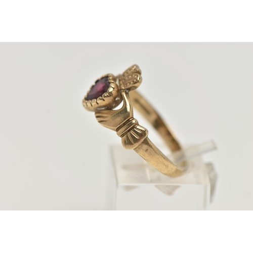 126 - A 9CT GOLD GARNET CLADDAGH RING, the heart shape garnet to the Claddagh design ring, with 9ct hallma... 