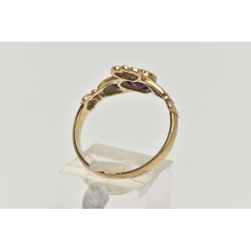 126 - A 9CT GOLD GARNET CLADDAGH RING, the heart shape garnet to the Claddagh design ring, with 9ct hallma... 