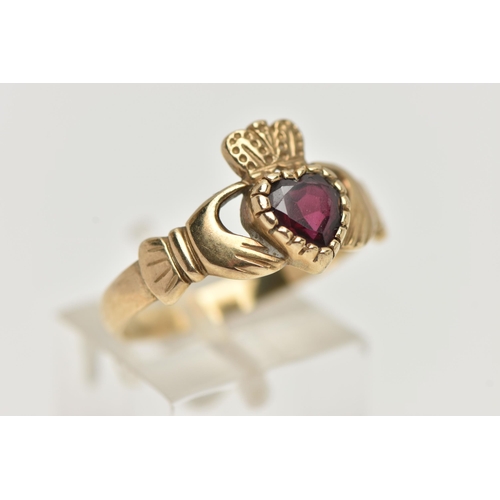 126 - A 9CT GOLD GARNET CLADDAGH RING, the heart shape garnet to the Claddagh design ring, with 9ct hallma... 