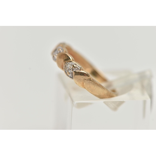 132 - A 9CT GOLD DIAMOND DRESS RING, the front half ring set with heart shape panels alternatively set wit... 