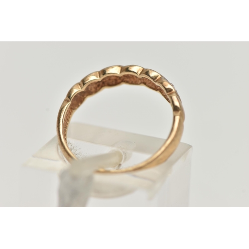 132 - A 9CT GOLD DIAMOND DRESS RING, the front half ring set with heart shape panels alternatively set wit... 