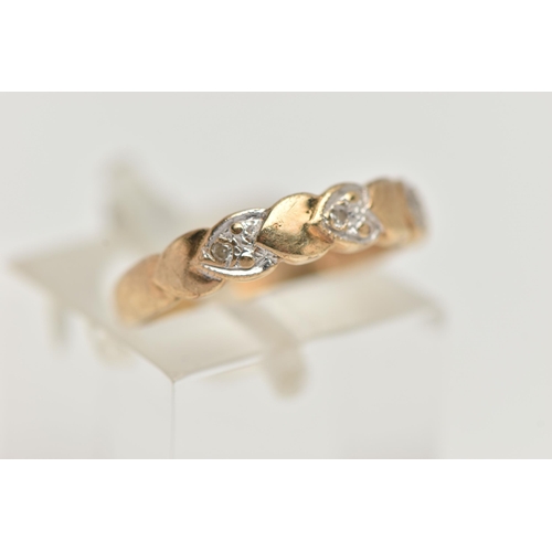 132 - A 9CT GOLD DIAMOND DRESS RING, the front half ring set with heart shape panels alternatively set wit... 