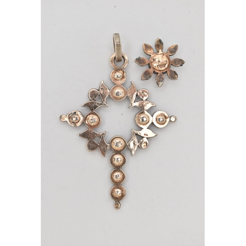 134 - A DIAMOND SET CROSS PENDANT, set with flat cut diamonds, with separate flower shape diamond set pane... 