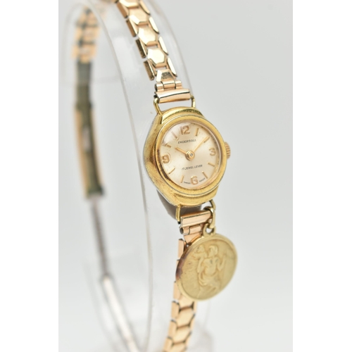 140 - A LADYS 'INGERSOLL' WRISTWATCH AND A YELLOW METAL CHARM, hand wound movement, round dial signed 'Ing... 